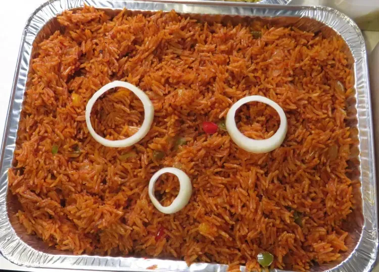 Tray of Jollof Rice, 20 Grilled Chicken & Fruit Shoot Drink